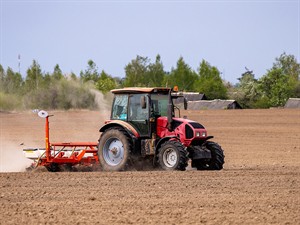 shutterstock_2630029929_farmer is driving a tractor_lauksaimnieks brauc ar traktoru.jpg