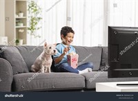 stock-photo-kid-eating-popcorn-and-watching-tv-with-his-dog-2626261135.jpg
