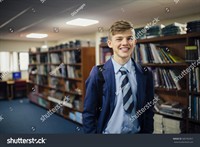 stock-photo-portrait-of-a-teen-student-in-the-library-of-his-school-585782957.jpg