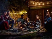 shutterstock_2695876511_family gathering around campfire_ģimene pie ugunskura.jpg