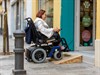shutterstock_2536576695_Electric wheelchair user_Sieviete elektriskajā ratiņkrēslā.jpg
