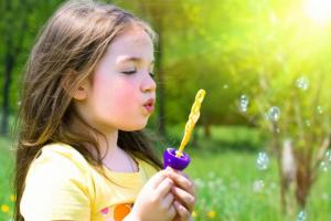 Child-Girl-Bubbles-Grass-Hobby-Breathing-433x650.jpg