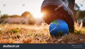 stock-photo-planet-is-under-threat-the-shoe-presses-on-the-layout-of-the-planet-earth-the-concept-of-an-2169778727.jpg