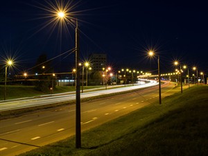 shutterstock_720324037_Light trails from cars in Riga_Gaismas pēdas no mašīnām Rīgā.jpg