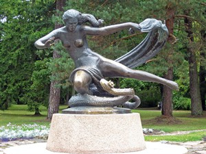 Grandpa Shutterstock_bronze statue of woman and snake in Lithuania_sievietes ar čūsku bronzas skulptūra Lietuvā.jpg