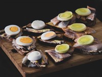 shutterstock_2724272815_Traditional Latvian sprat sandwiches_maize ar siļķi.jpg