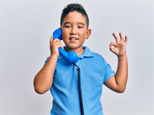 Shutterstock_1856301964_boy talking trough phone_zēns runā pa telefonu.jpg