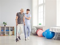 shutterstock_2681912703_nurse helping with walking rehabilitation_medbrālis palīdz ar rehabilitāciju.jpg