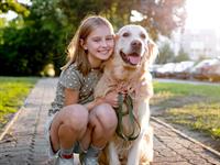 shutterstock_2423731769_girl with dog_meitene ar suni.jpg
