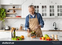 stock-photo-healthy-nutrition-concept-happy-senior-man-cooking-fresh-vegetable-salad-in-kitchen-smiling-2343899699.jpg