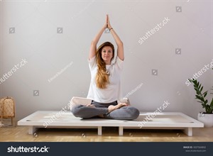 stock-photo-beautiful-woman-doing-yoga-in-her-apartment-1837560892.jpg