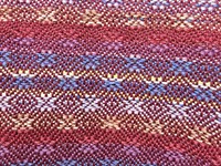 shutterstock_2693434381_woven blanket with latvian ornament_austa sega ar latviešu ornamentiem.jpg