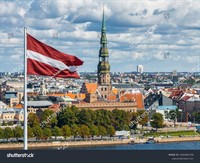 stock-photo-beautiful-latvian-flag-flutters-on-wind-with-riga-old-town-in-the-background-in-latvia-patriotic-2420302739.jpg