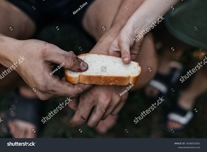 stock-photo-child-gives-a-homeless-poor-man-a-piece-of-bread-in-a-modern-capitalist-society-economic-recession-2539252931.jpg